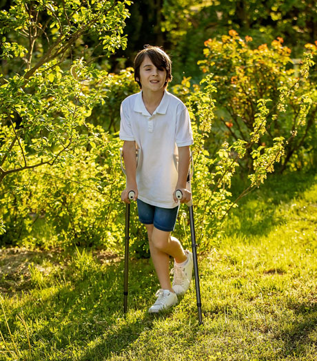 Boy using crutches